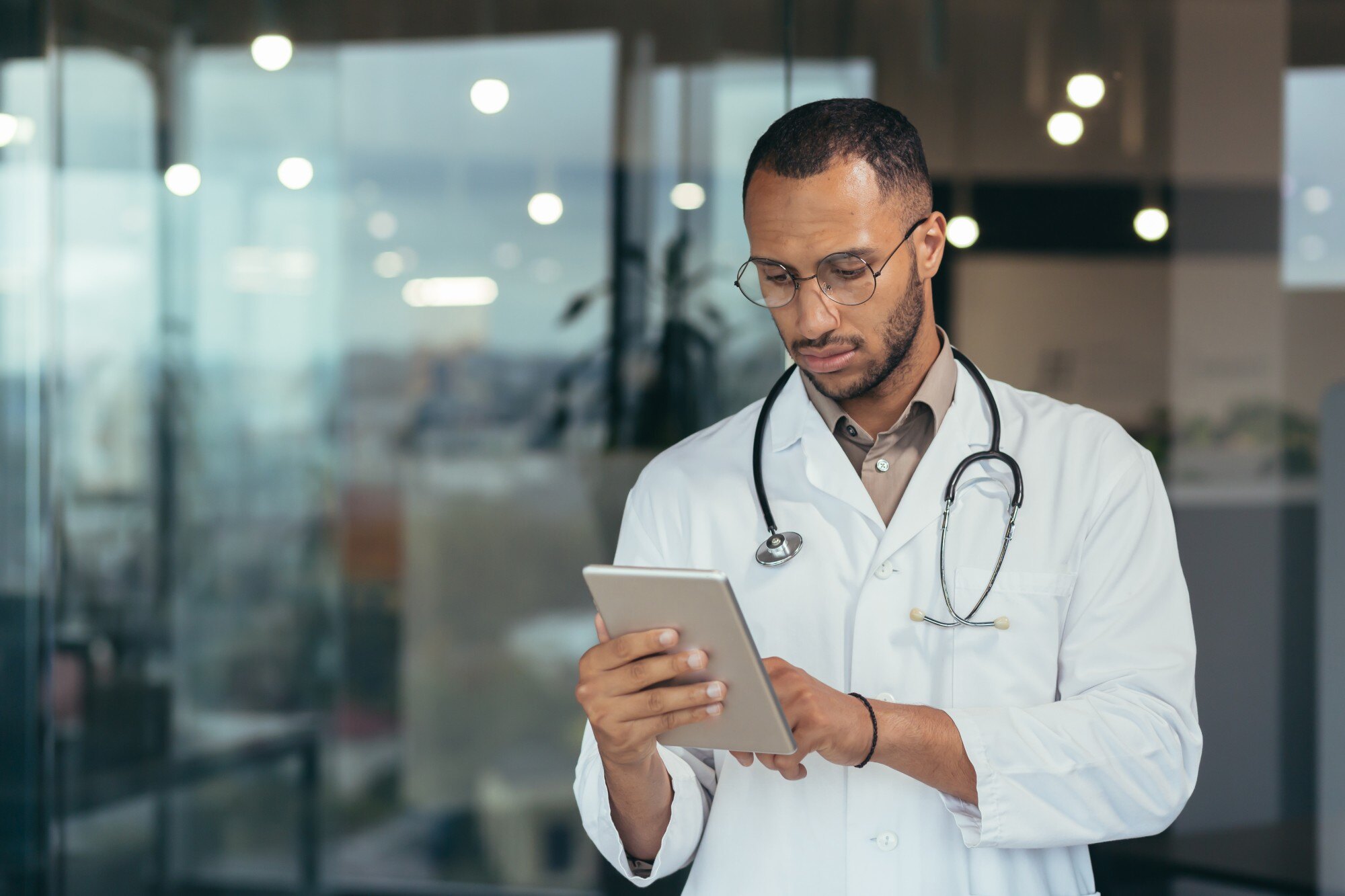 male doctor holding tablet