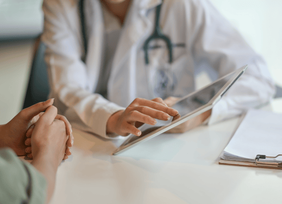 clinician-using-digital-tablet