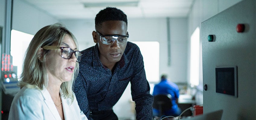 man-woman-looking-at-data