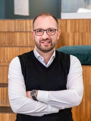 Portrait of Majd Mirza, Chief Innovation Officer at Viedoc, looking directly at the camera in a professional setting.