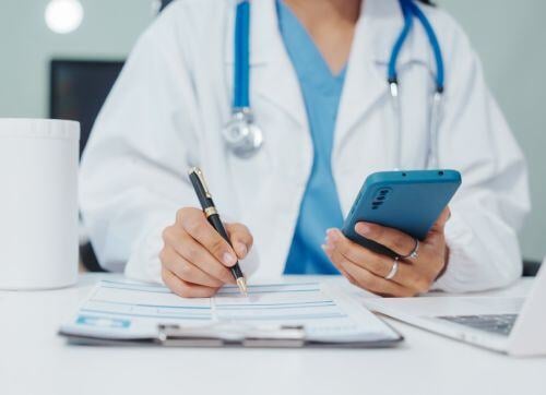 woman-doctor-document-phone