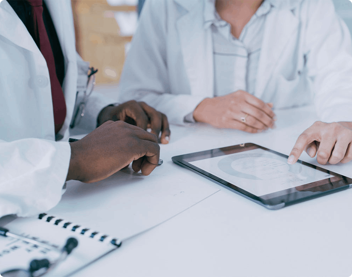 people looking at data on tablet