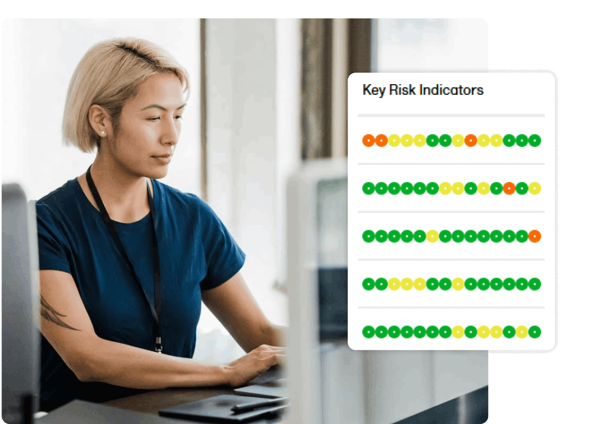 woman working on computer with Key risk indicators UI