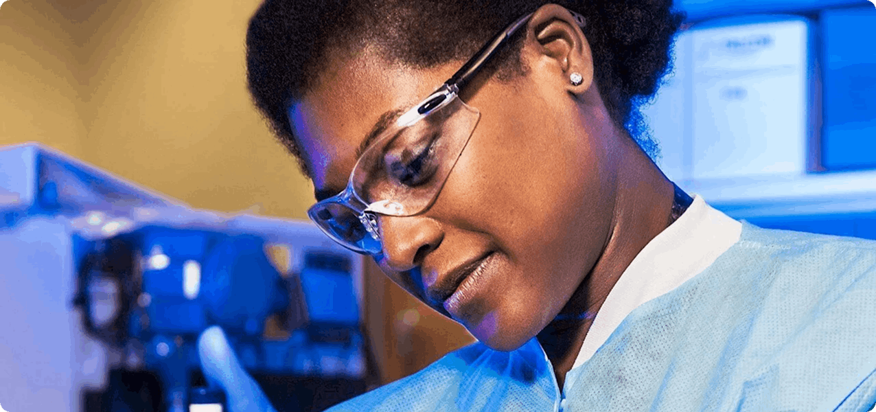 Woman with lab coat and goggles