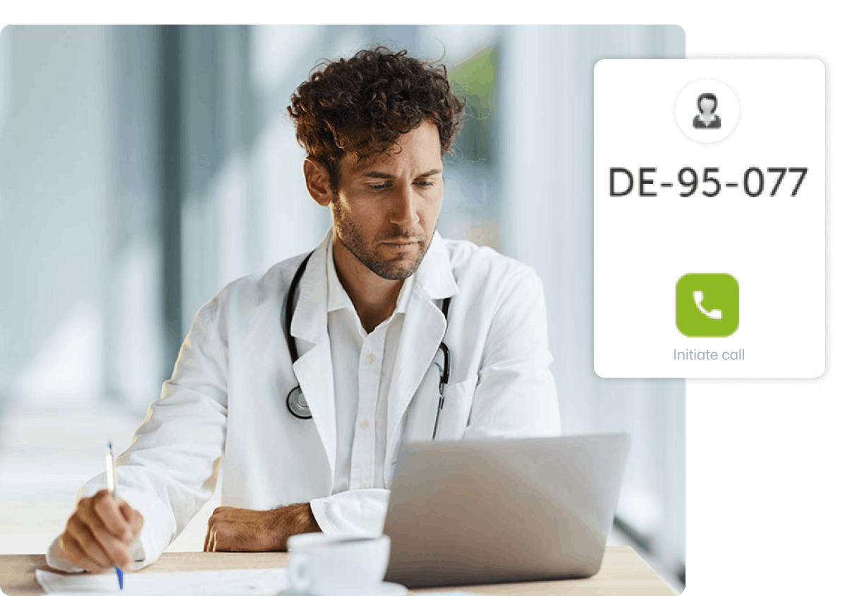 man in labcoat looking at laptop screen and holding pen with Viedoc connect call UI