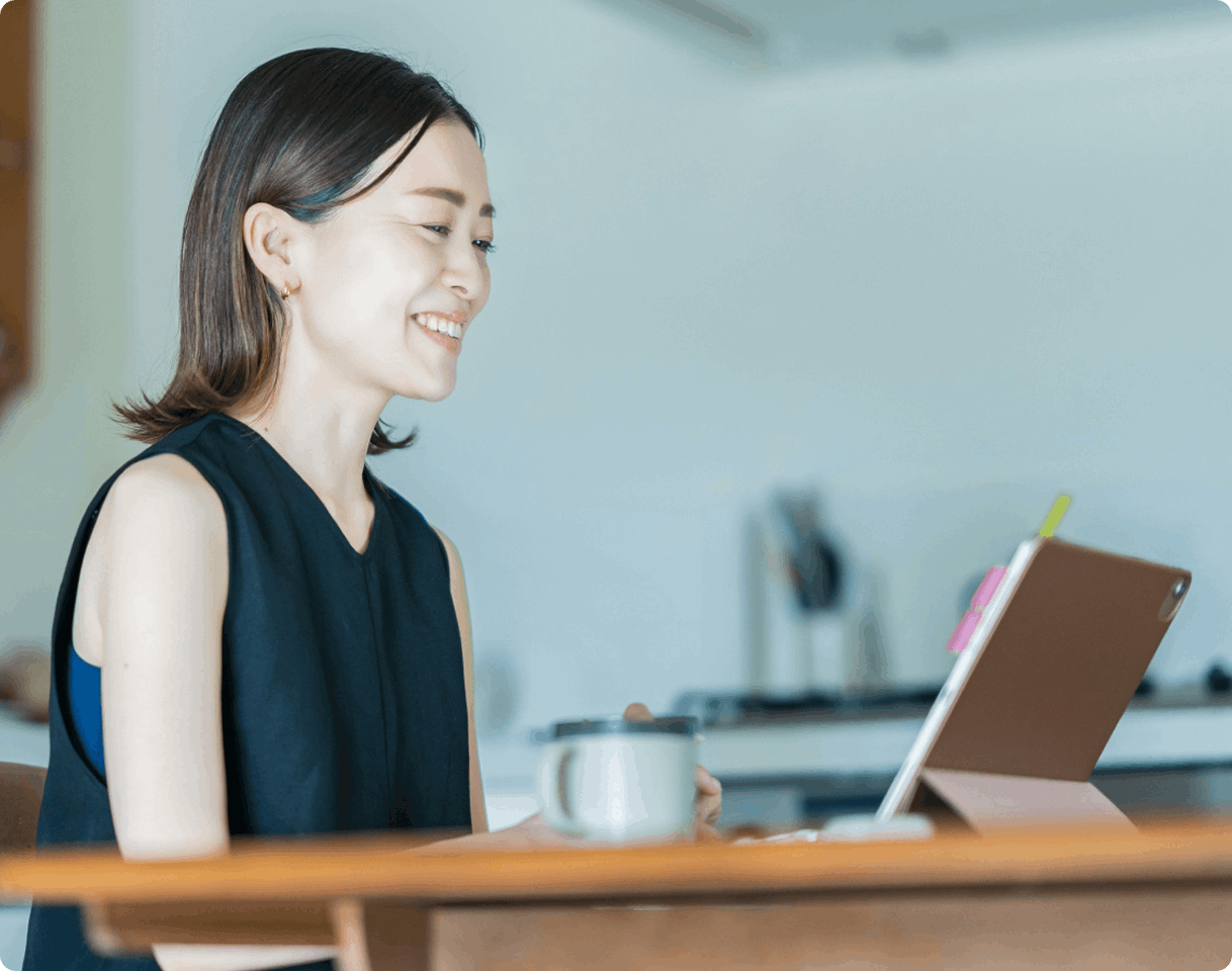 woman at home on call using tablet