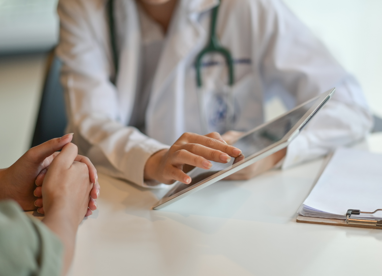 clinician-using-digital-tablet