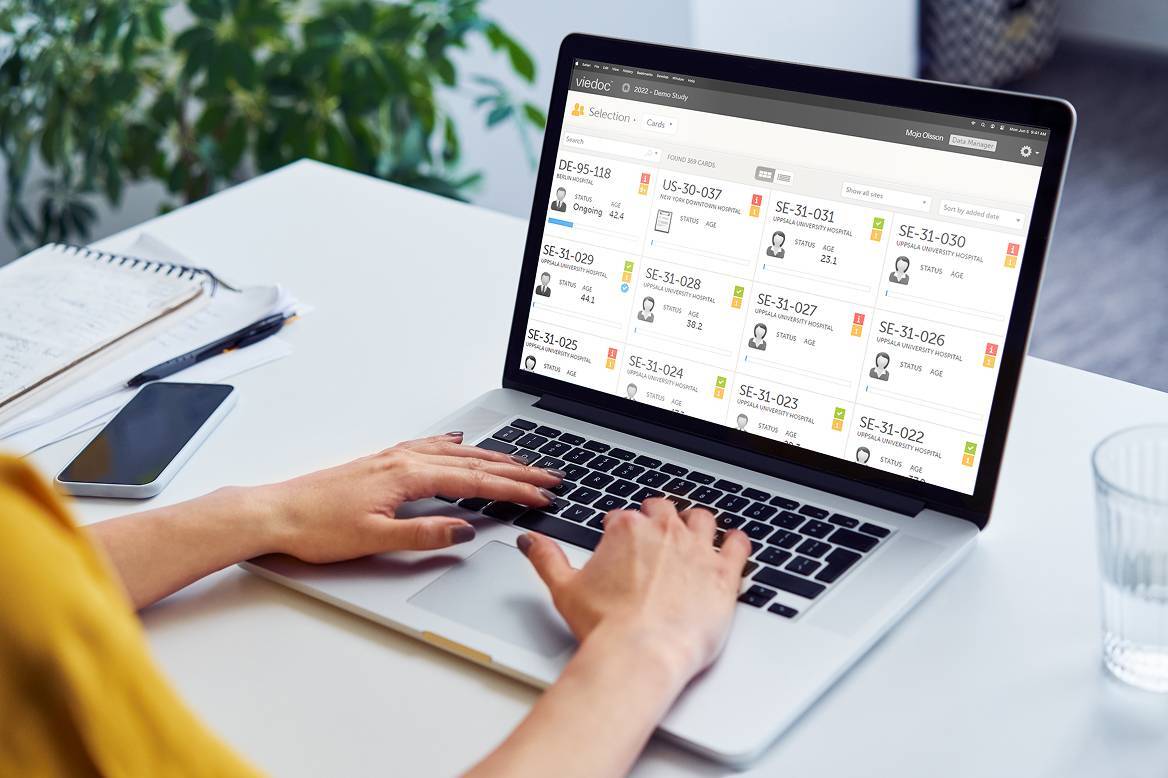 Woman using viedoc clinic on macbook